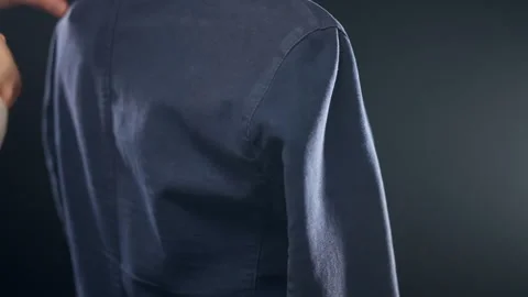Final measures of tailored male jacket on mannequin using tape measure Stock Footage 306936324