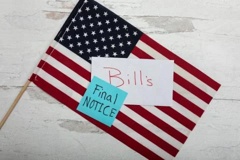 Final notice bills sign laying on a Patrotic American flag Stock Photos