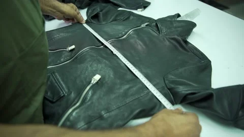 Final prosses lether black jacket in factory Stock Footage 202460978
