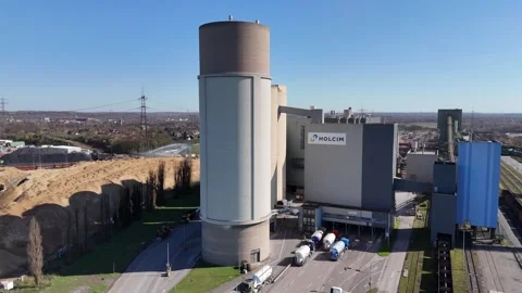 Final riverside view of industrial terminal and stockpiles Stock Footage 331205935