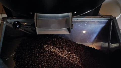 Final Roast Stage: Beans Falling from Spinning Drum Stock-Footage 307591088