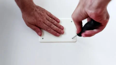 Final Screw Secured: Precision Finish on Electrical Cover Install Vídeos de archivo 315153145