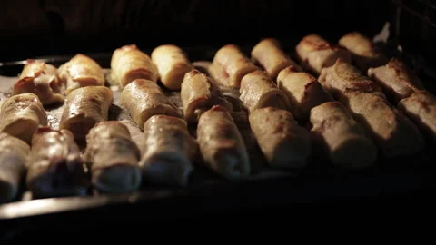 Final Stage of Baking Golden Meat Crepe Rolls Inside the Oven1 Stock Footage 332159733