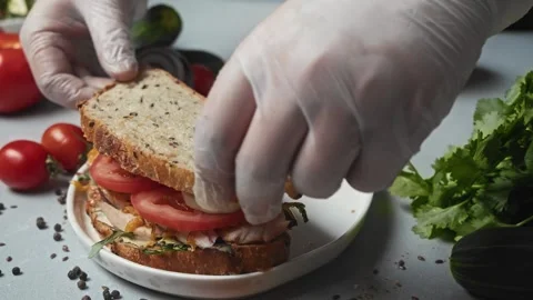 Final stage of cooking process is vegetable sandwich with sauce of two slices of Stock Footage 292154526