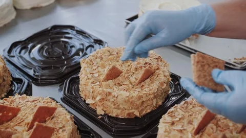The final stage of making a cake in an industrial confectionery bakery Stock Footage 322511949
