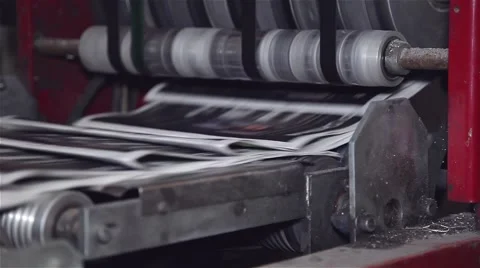 Final stage of newspaper being printed on a printing press Stock-Footage 57324211