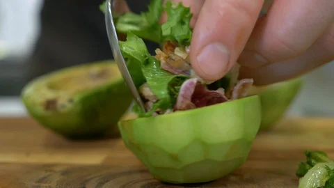 The final touch of the chef - avocado salad leaves Stock Footage 91231163