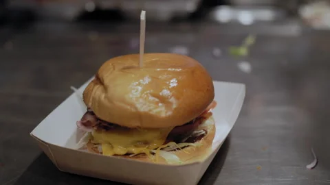 Final Touch: Toothpick in Gourmet BBQ Burger Stock Footage 307068128