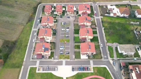 Finalizing construction of a village, captured from above showing residenti.. 動画素材 296365656