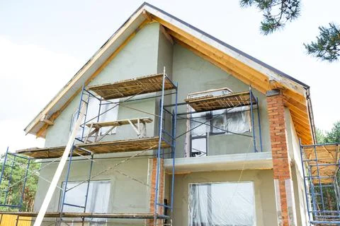 Finalizing facade plastering, scaffolded finishing, insulation protection, .. Stock Photos