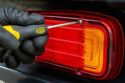Finalizing truck tail light assembly repair 库存照片