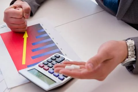 Finance analyst feeling sick due to bad results Stock Photos