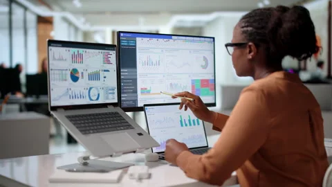 Finance Analyst Reviewing Dashboard Data On Laptop Stock Footage 345313779