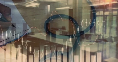 Finance analyst taking notes while candlestick charts fade in over desk notebook Stock Footage 334036854