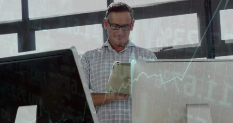 Finance analyst tapping touchscreen tablet reviewing data and activating charts 動画素材 318260165