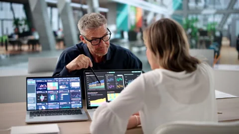 Finance Analysts Review Dashboard Data Together Stock Footage 335877368