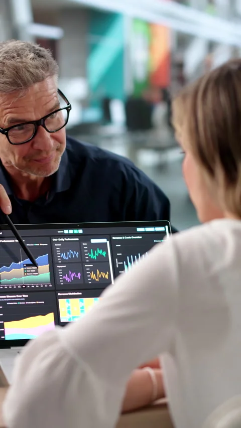 Finance Analysts Review Dashboard Data Together Stock Footage 336793029