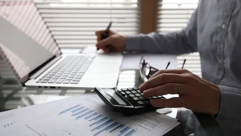 Finance and accounting, calculating return on investment, budget planning Stock Footage 140033032