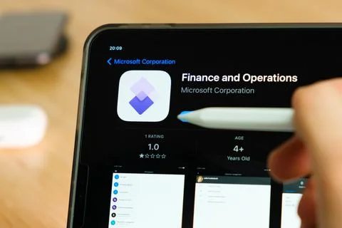 Finance and Operations logo shown by apple pencil on the iPad Pro tablet screen Stock Photos
