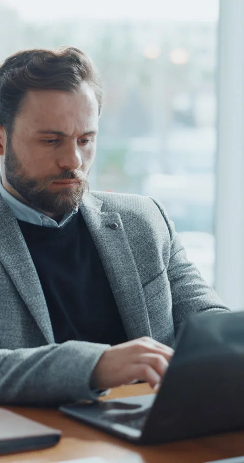 Finance, business man or typing with laptop by window, planning or research for Stock Footage 320100168