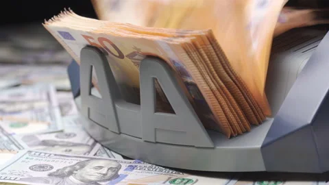 Finance concept. Macro shot of cash bill counter money machine counts 50 euro Video stock 148576909