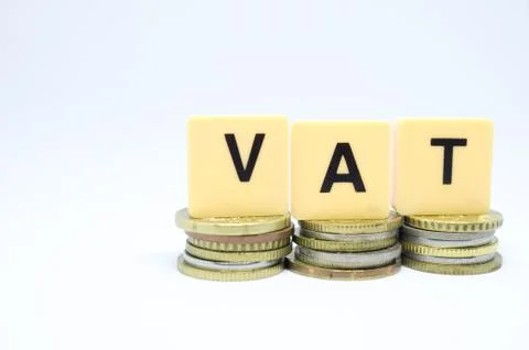 Finance Concept with Stack of Coins - VAT (Value Added Tax ) written on. Stock Photos