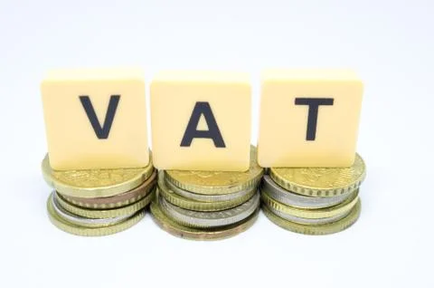 Finance Concept with Stack of Coins - VAT (Value Added Tax ) written on. Stock Photos