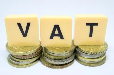 Finance Concept with Stack of Coins - VAT (Value Added Tax ) written on. Stock Photos