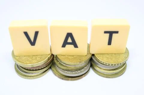 Finance Concept with Stack of Coins - VAT (Value Added Tax ) written on. Stock Photos