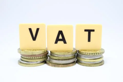 Finance Concept with Stack of Coins - VAT (Value Added Tax ) written on. Stock Photos