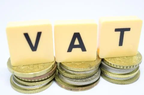 Finance Concept with Stack of Coins - VAT (Value Added Tax ) written on. Stock Photos