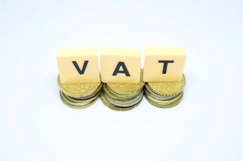 Finance Concept with Stack of Coins - VAT (Value Added Tax ) written on. Stock Photos