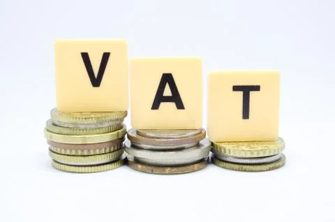 Finance Concept with Stack of Coins - VAT (Value Added Tax ) written on. Stock Photos