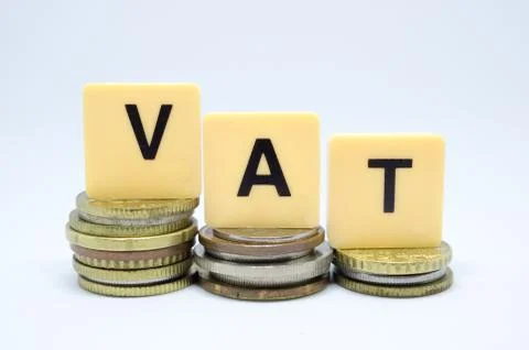 Finance Concept with Stack of Coins - VAT (Value Added Tax ) written on. Stock Photos