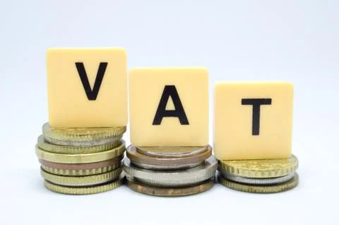 Finance Concept with Stack of Coins - VAT (Value Added Tax ) written on. Stock Photos