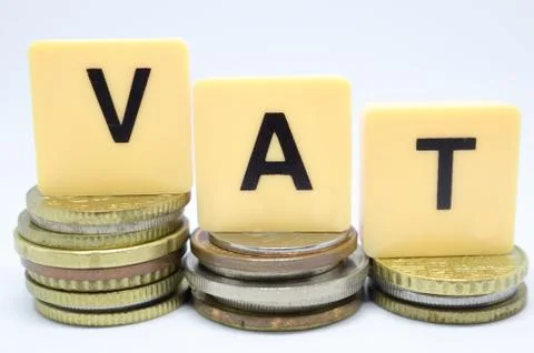 Finance Concept with Stack of Coins - VAT (Value Added Tax ) written on. Stock Photos