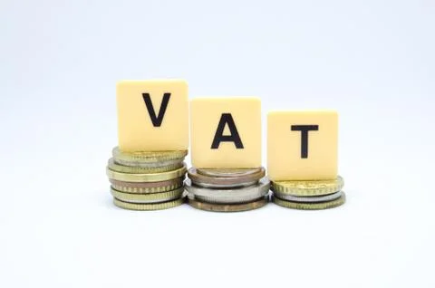 Finance Concept with Stack of Coins - VAT (Value Added Tax ) written on. Stock Photos