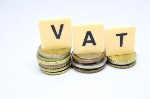 Finance Concept with Stack of Coins - VAT (Value Added Tax ) written on. Stock Photos