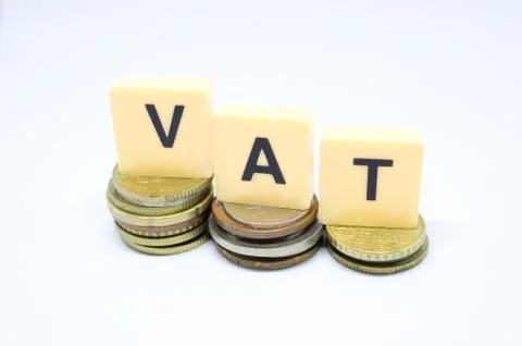 Finance Concept with Stack of Coins - VAT (Value Added Tax ) written on. Stock Photos