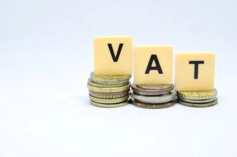Finance Concept with Stack of Coins - VAT (Value Added Tax ) written on. Stock Photos