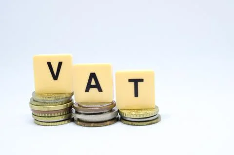 Finance Concept with Stack of Coins - VAT (Value Added Tax ) written on. Stock Photos