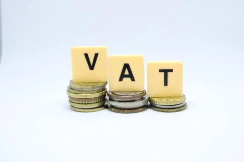 Finance Concept with Stack of Coins - VAT (Value Added Tax ) written on. Stock Photos