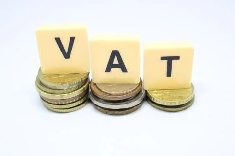 Finance Concept with Stack of Coins - VAT (Value Added Tax ) written on. Stock Photos