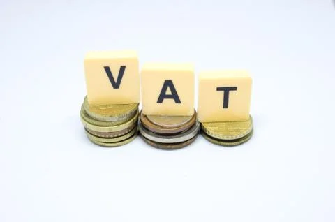 Finance Concept with Stack of Coins - VAT (Value Added Tax ) written on. Stock Photos