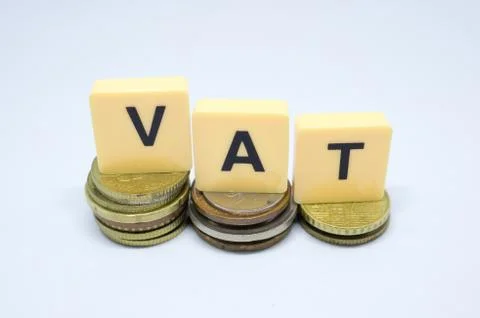 Finance Concept with Stack of Coins - VAT (Value Added Tax ) written on. Stock Photos