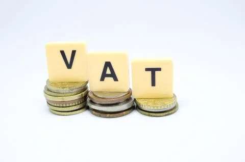 Finance Concept with Stack of Coins - VAT (Value Added Tax ) written on. Stock Photos