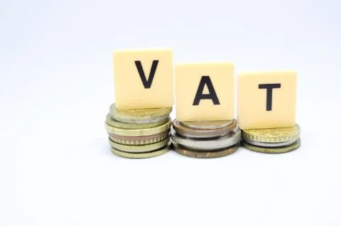 Finance Concept with Stack of Coins - VAT (Value Added Tax ) written on. Stock Photos