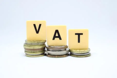 Finance Concept with Stack of Coins - VAT (Value Added Tax ) written on. Stock Photos