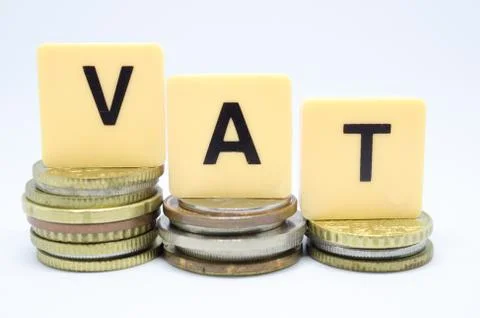 Finance Concept with Stack of Coins - VAT (Value Added Tax ) written on. Stock Photos