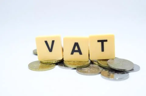 Finance Concept with Stack of Coins - VAT (Value Added Tax ) written on. Stock Photos
